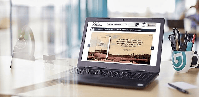 a laptop with books